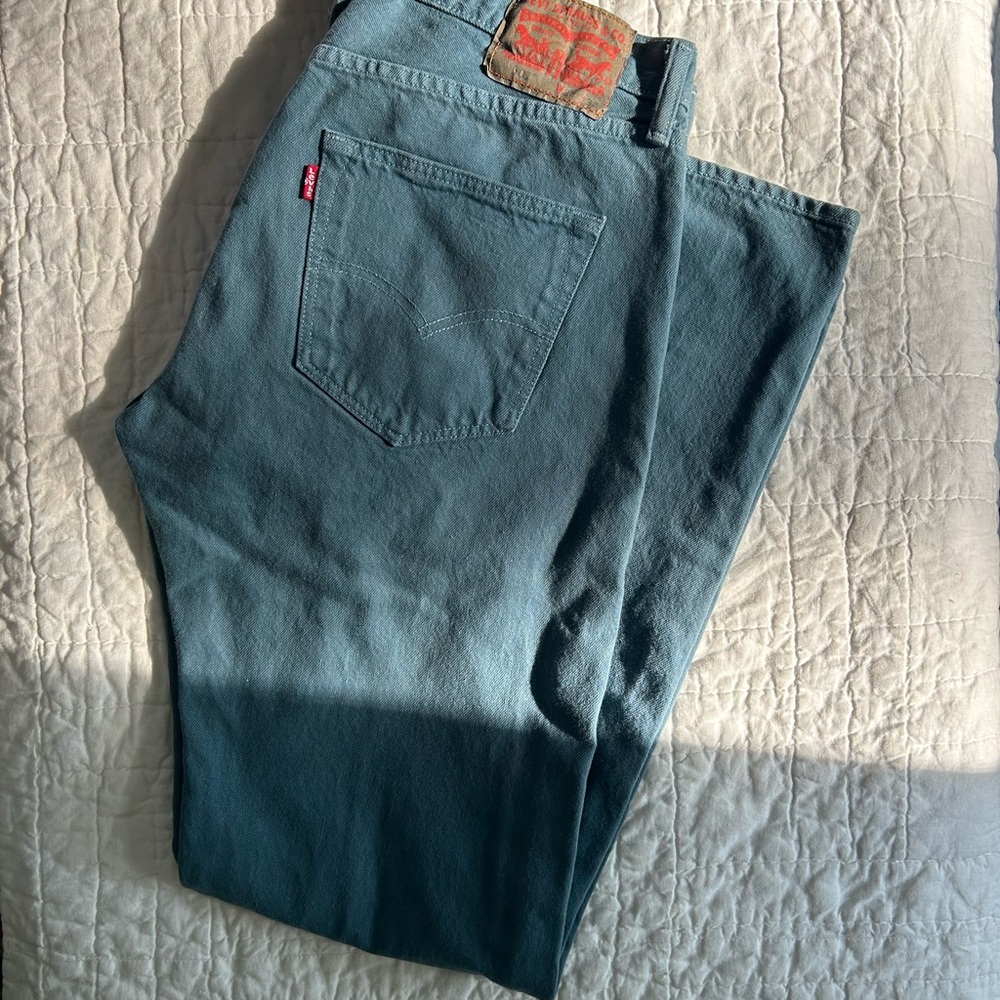 Levi's 501 button fly in washed blue color